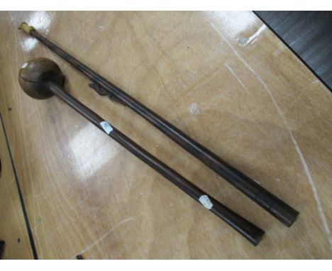 A South African knob kerrie and a similar blow pipe.