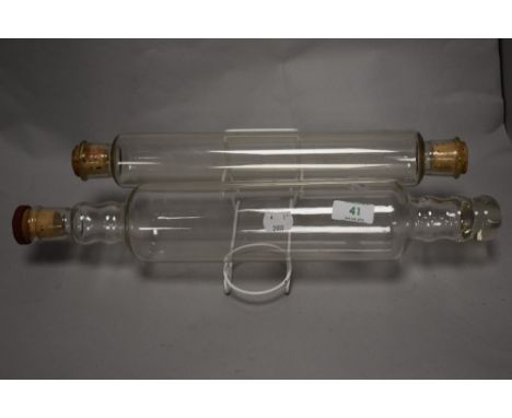 A 1950s Pyrex glass rolling pin and another, the former measuring 44cm long