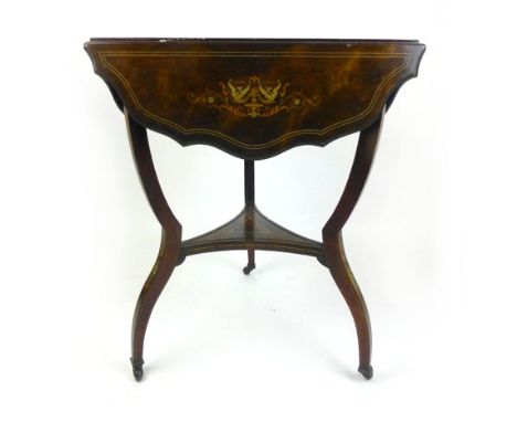 A rosewood, marquetry and line inlaid triangular drop leaf table with tripartite under tier on ceramic castors, h. 70 cm, dia