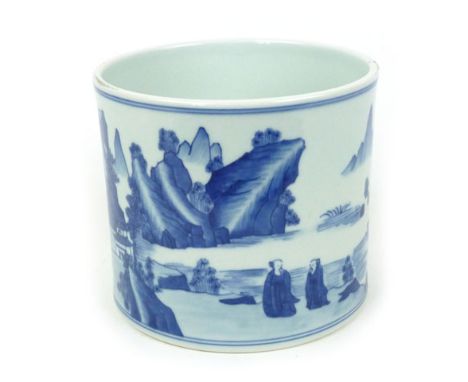 A Chinese biton/brush pot of squat cylindrical form, the white ground decorated with blue rural scenes within blue bands, Kan