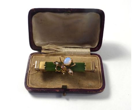 A 19th century yellow metal mounted green jade bar brooch centrally decorated with a winged insect set opal, small pearls and