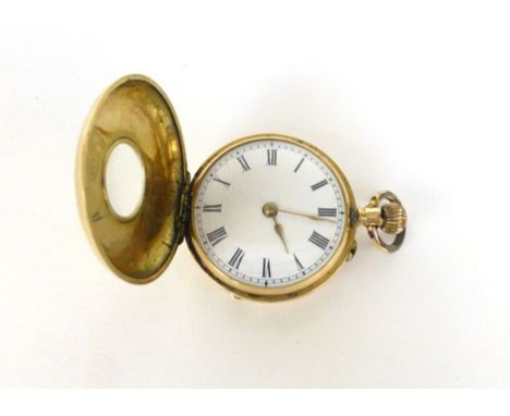 A 14ct yellow gold cased half hunter fob watch, the white enamel dial with black Roman numerals within an engine turned case 