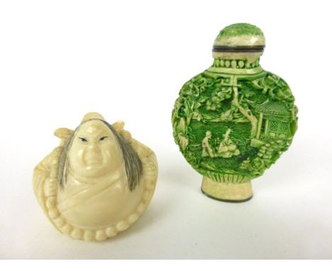 A 19th century carved ivory netsuke in the form of a rotund man, together with a green cinnabar style snuff bottle 

* Please