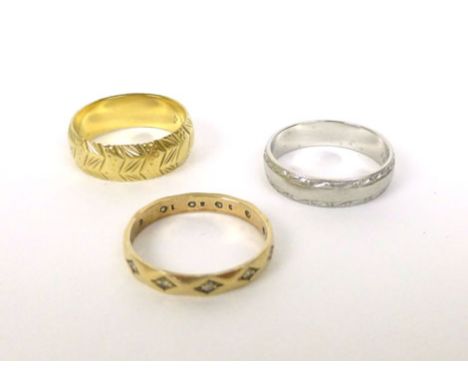 An 18ct yellow gold wedding band, ring size P, 5.5 gms, a platinum wedding band ring size P, 5.2 gms and a 9ct yellow gold ba