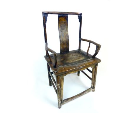 A (?) 19th century Chinese elm open arm chair with the Chinese character for longevity  carved into the splat above the solid