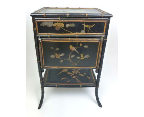 A Victorian bamboo and Japenese lacquered panel sewing table, the lift up lid revealing silk button upholstered interior abov