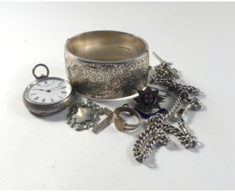 A florally engraved silver cuff-type bracelet, a silver cased open face fob watch, watch chain and fobs, together with a cros