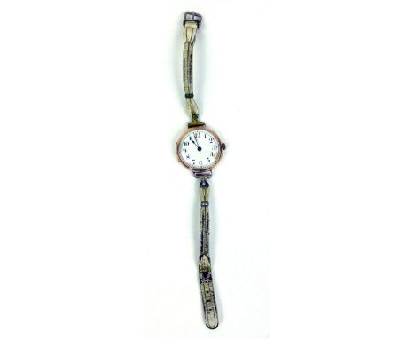 A 9ct yellow gold cased wristwatch by Rolex, the white enamel dial with black/red Arabic numerals on a later strap CONDITION 
