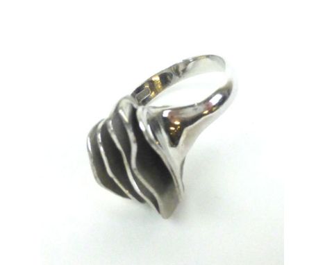 A modern 9ct white ring of abstract design, maker AC Co., ring size R, 9.8 gms 