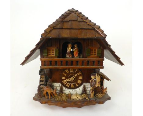 A Schneider 20th century cuckoo clock in the form of a chalet. h. 37 cm, w. 36 cm, d. 23 cm CONDITION REPORT: General wear an