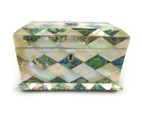 A Victorian mother-of-pearl, abalone and ivory tea caddy, with initialed cartouche to top and two tea compartments on squat b