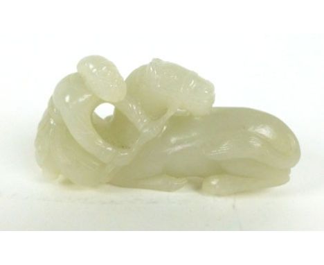 A late 19th century Chinese jade figure modelled as a man and horse,  8 cm x 4 cm