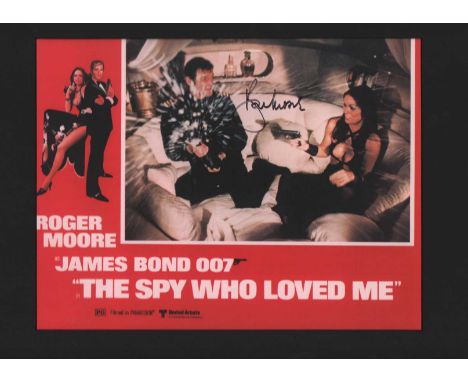 Roger Moore autographed mounted print. Lovely reproduction print of a lobby card from the James Bond film The Spy Who Loved M