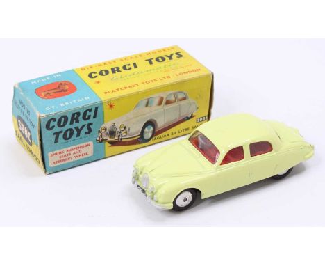 Corgi Toys No. 208S Jaguar 2.4L saloon comprising of lemon yellow body with red interior and spun hubs, fitted with working s