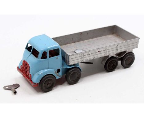 Mettoy Castoys clockwork articulated lorry comprising a light blue cab, with red grille, base &amp; interior, silver trailer,