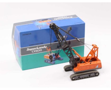 A Japanese 1/50 scale model of a Hitachi Super Landy CX500 hydraulic crawler crane finished in orange and two-tone grey, hous