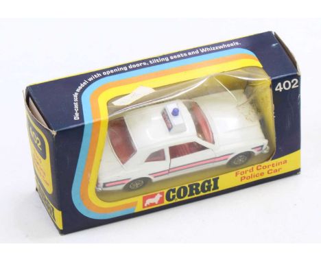 A Corgi Toys Whizzwheels No. 402 Ford Cortina Police Car in white with a red interior and side stripes (E-NM,BG)