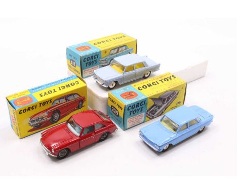 Corgi Toys boxed model group of 3 comprising No. 327 MGB GT, red body, with a blue interior, wire wheels, and a suitcase to t