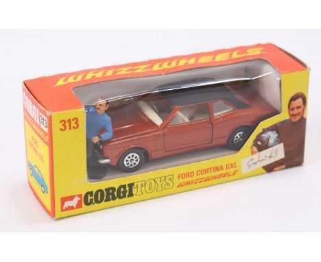 Corgi Toys No. 313, Ford Cortina in bronze complete with Graham Hill figure, sold in its original window style box (VNMM-BNM)