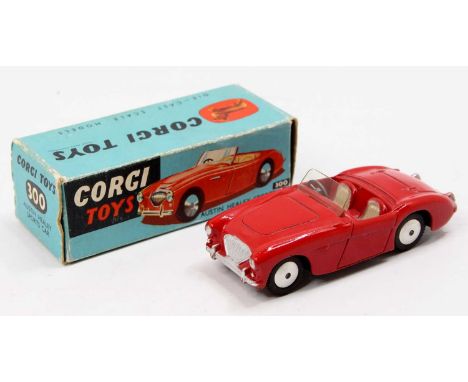 Corgi Toys, 300 Austin Healey sports car, red body with cream seats, flat spun hubs, in the original blue and yellow all-card