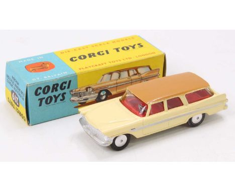 Corgi Toys No. 219 Plymouth Sports Suburban station wagon comprising of cream body with brown roof, light tan base, and red i