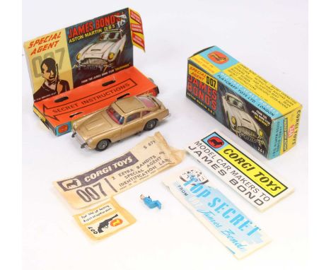 Corgi Toys No. 261 James Bond Aston Martin DB5 comprising of gold body with red interior, working mechanisms and cast wire wo