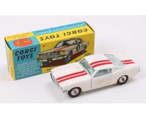 Corgi Toys No. 325 Ford Mustang Fastback 2+2 competition model, comprising of a white body with red twin racing stripe, spun 