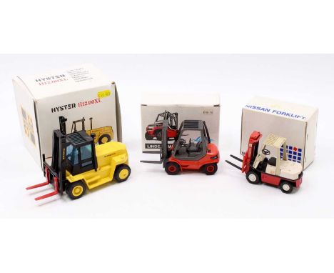 A collection of three various boxed mixed scale diecast forklift models to include an NZG No. 362 Hyster 12.00 XL forklift, a