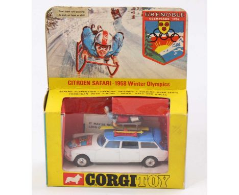 A Corgi Toys No. 499 Citroen Safari 1968 Winter Olympics car, comprising white and blue body with blue interior, with two fig