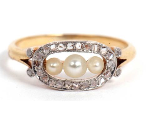 Small pearl and diamond ring featuring three graduated seed pearls in an openwork design framed with an old cut diamond surro