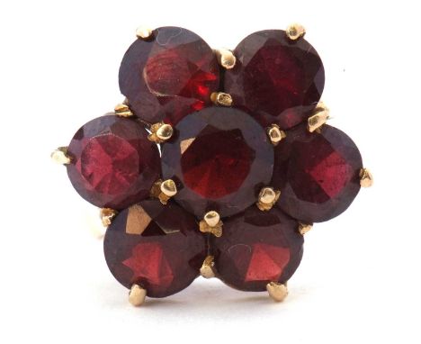 9ct gold large garnet cluster ring featuring seven round garnets, head size 18mm diameter, all in a basket setting, hallmarke