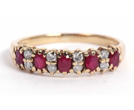 Small 9ct gold ruby and diamond ring featuring five small round cut rubies highlighted between with pairs of small diamonds, 