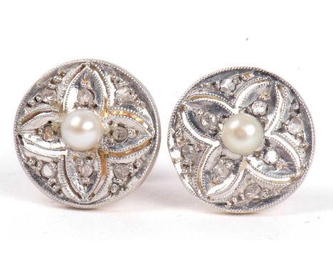 Pair of diamond and pearl stud earrings, each pair circular plaque centering a small seed pearl and eight small old cut diamo