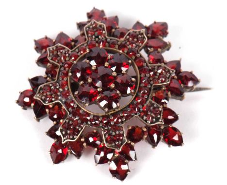 Vintage bohemian style garnet set starburst brooch, 30mm diameter