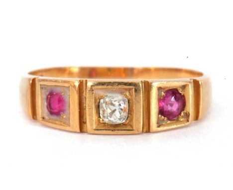 Antique 18ct gold diamond and ruby three stone ring featuring an old cut diamond flanked by two small round cut rubies, size 