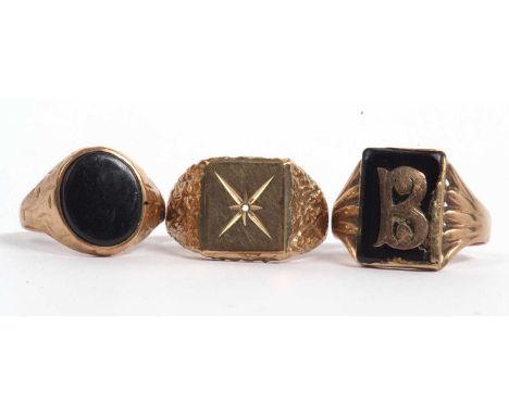 Mixed Lot: 9ct gold signet ring set with an oval shaped onyx panel, size Q-R, a large 9ct gold signet ring, the square panel 