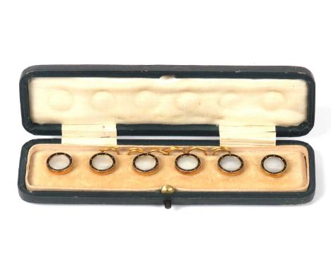 Cased set of six mother of pearl and black enamel dress studs, with mother of pearl centres and framed in black enamel, the v