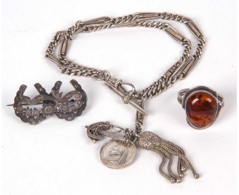 Mixed Lot: Silver double Albert watch chain, a silver double horseshoe brooch, together with an amber and white metal ring (3
