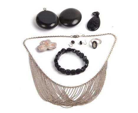 Mixed lot to include a silver clover leaf brooch, two vintage vulcanite lockets, jet pendant and bracelet etc