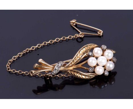 9ct gold seed pearl and diamond brooch, a floral spray design featuring five small seed pearls and highlighted with eight sma