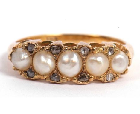 Antique seed pearl and diamond ring featuring five split seed pearls highlighted between with eight small old cut diamonds al