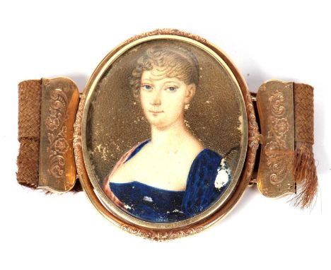 Victorian oval gold backed framed miniature, watercolour on paper depicting the head and shoulders portrait of a young lady, 
