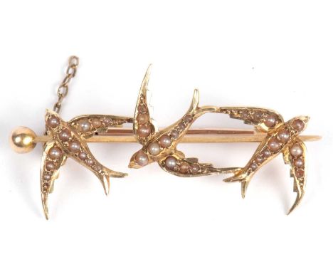 Vintage 'diving bird' brooch set throughout with small graduated seed pearls and stamped 15ct, 4cm long