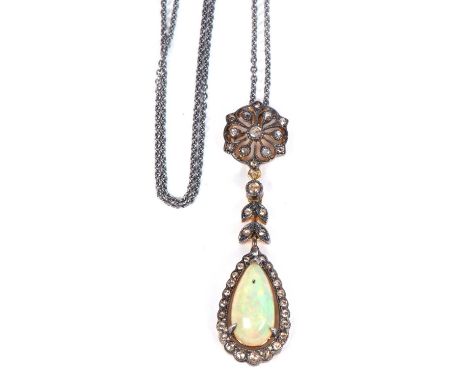 Opal and diamond drop pendant, a pear shaped opal and diamond cluster pendant suspended from a diamond highlighted leaf and c