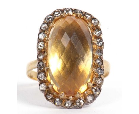 Citrine and diamond dress ring, the large faceted lemon coloured cushion shaped citrine 16x10mm, set within an old cut diamon