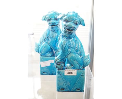 Two Chinese ceramic statue models of dogs of foo (2)