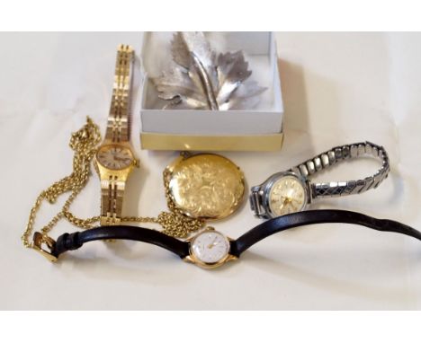 Three ladies wrist watchesTo include Rotary, together with, a costume locket and chain and a marcasite and leaf brooch (5)