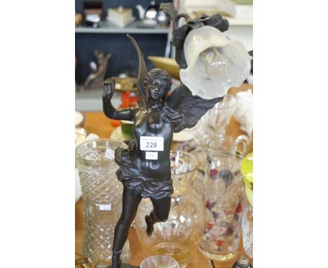 A late 19th Century spelter figural lamp with frosted glass shade (af) (sold electrically untested)