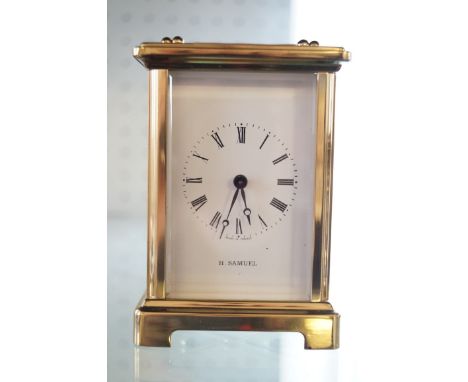 A French brass cased carriage clock, dial signed H. Samuel, seven jewels 
