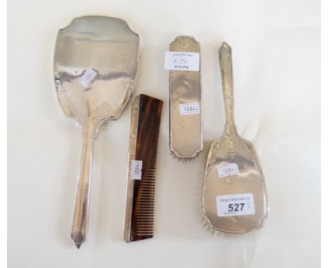 A Birmingham hallmarked silver backed four piece dressing table set comprising hand mirror, clothes brush, hair brush and hai